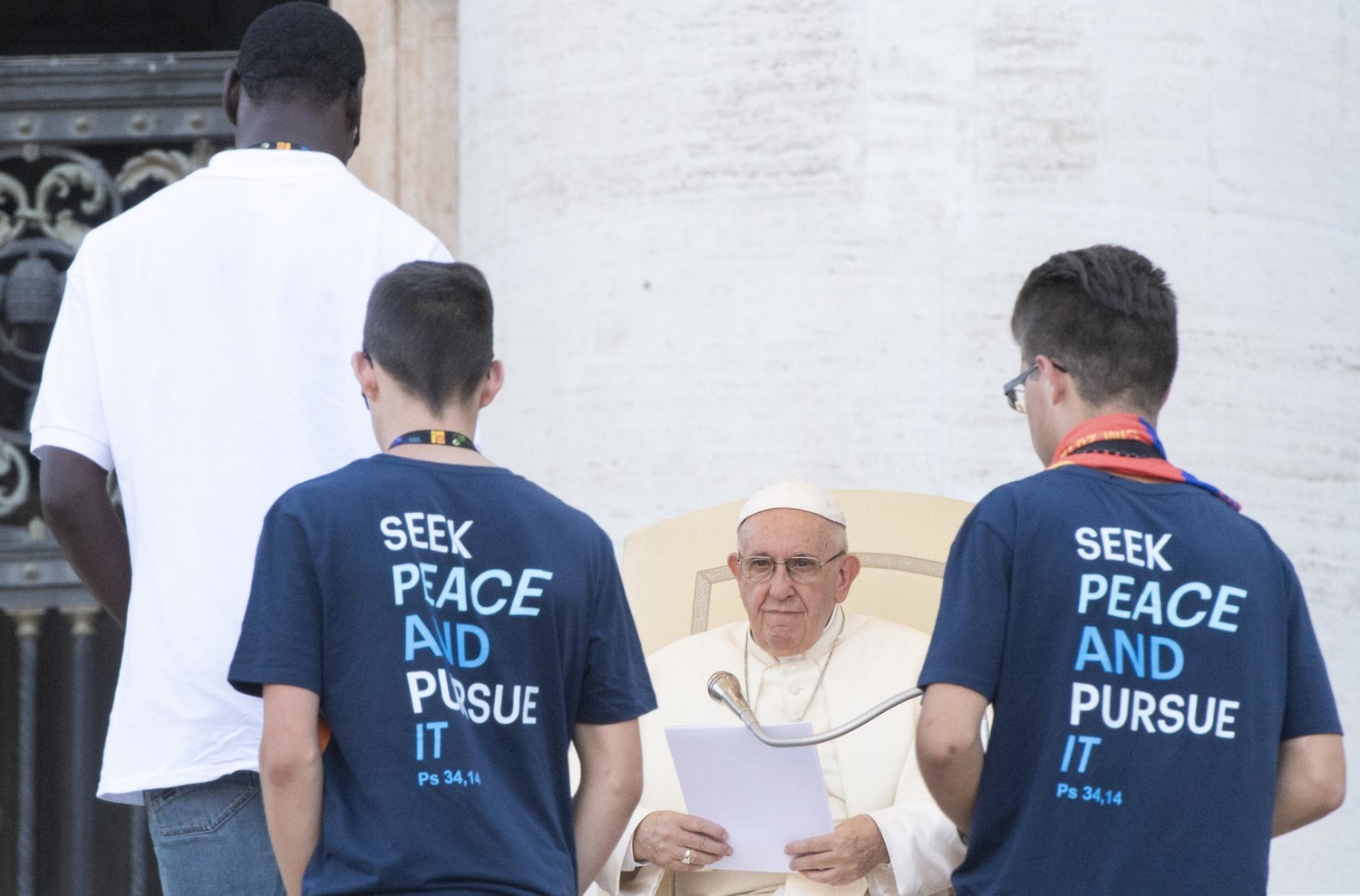 Young people approach Pope Francis during a special audience with altar servers July 31 in St. Peter’s Square at the Vatican.